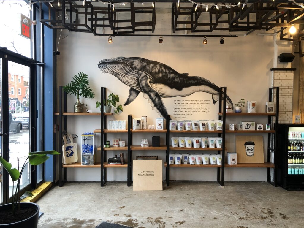 Image of a whale that was printed on the concrete wall of a coffee shop