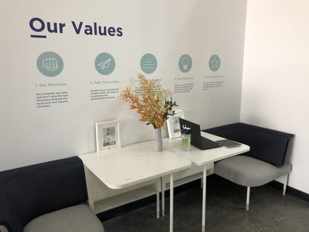 Image of company values printed on dry wall.