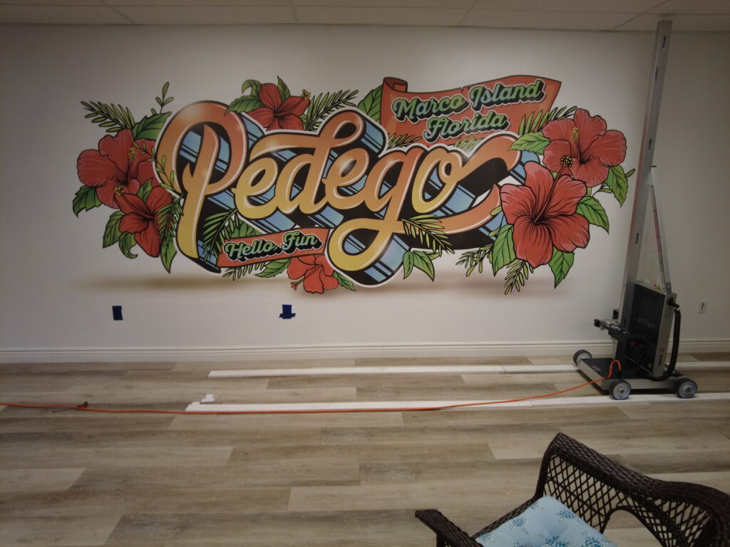 Image of the Pedego logo printed on dry wall